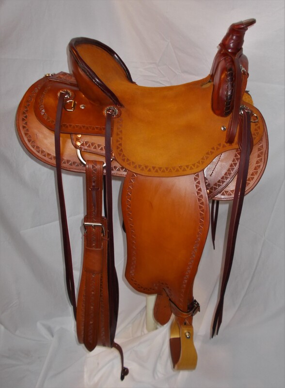 Trail saddle with ruff out seat